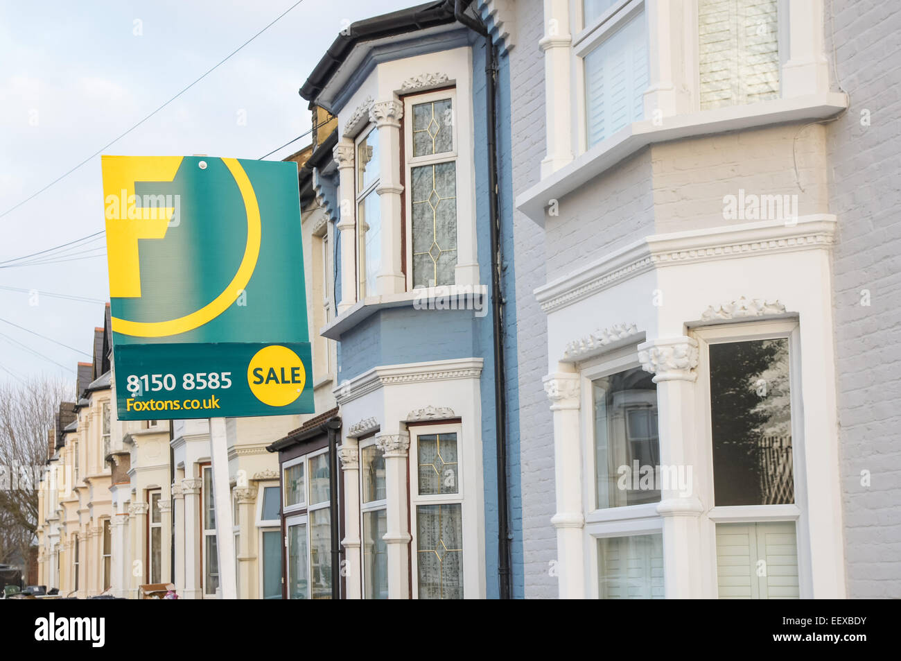 Foxtons real estate sale sign outside terraced houses in East London England United Kingdom UK Stock Photo