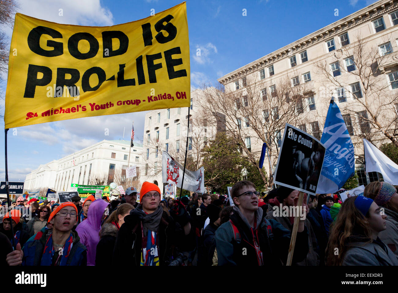 Washington DC, USA. 22nd Jan, 2015. Pro-Life supporters march carrying signs toward the Supreme Court building. Credit:  B Christopher/Alamy Live News Stock Photo
