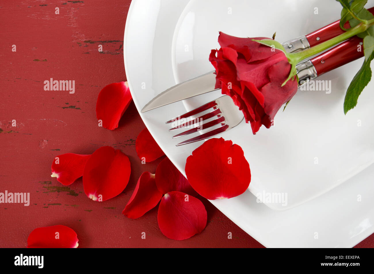 Romantic Valentines Day table place setting with white heart shape ...