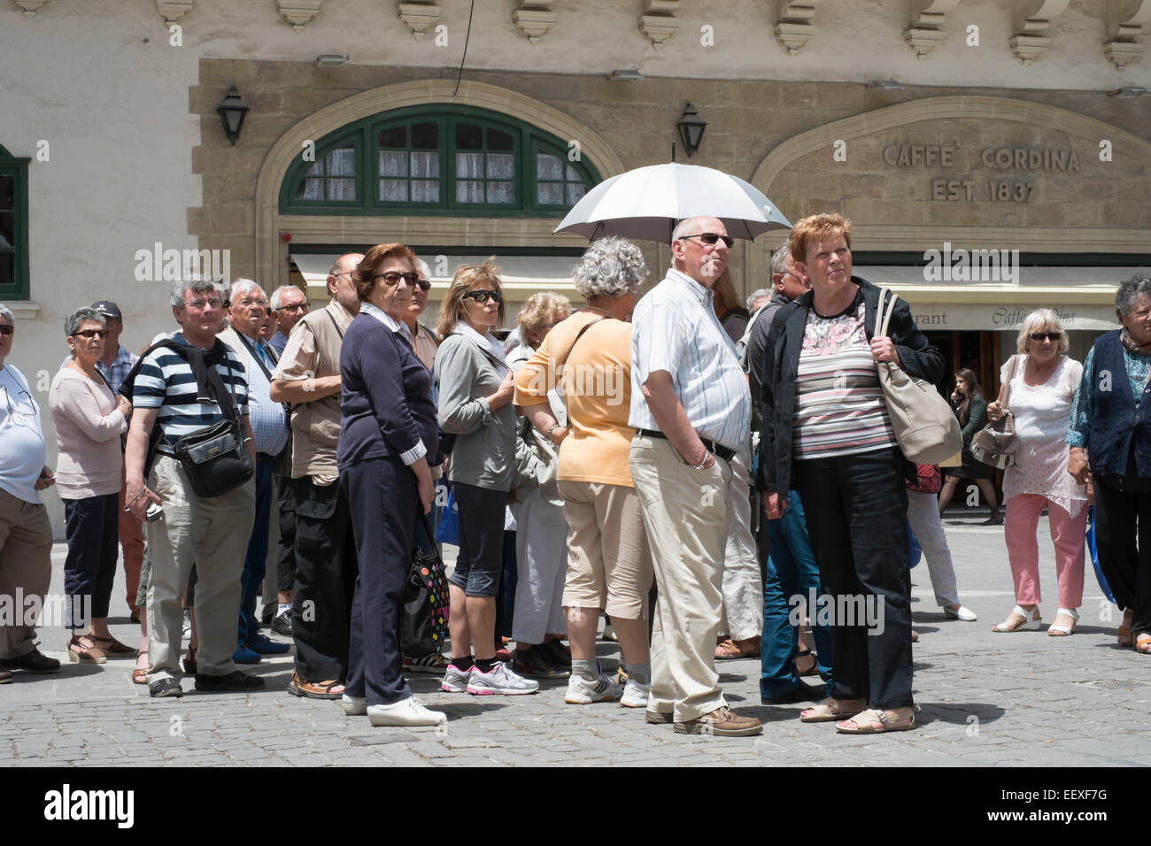 Tourists at Queen's Square in Valletta, Malta Stock Photo