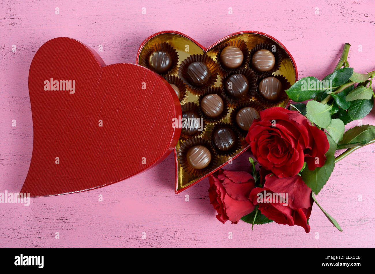 Happy Valentines Day red heart shape gift box of chocolates with bunch ...