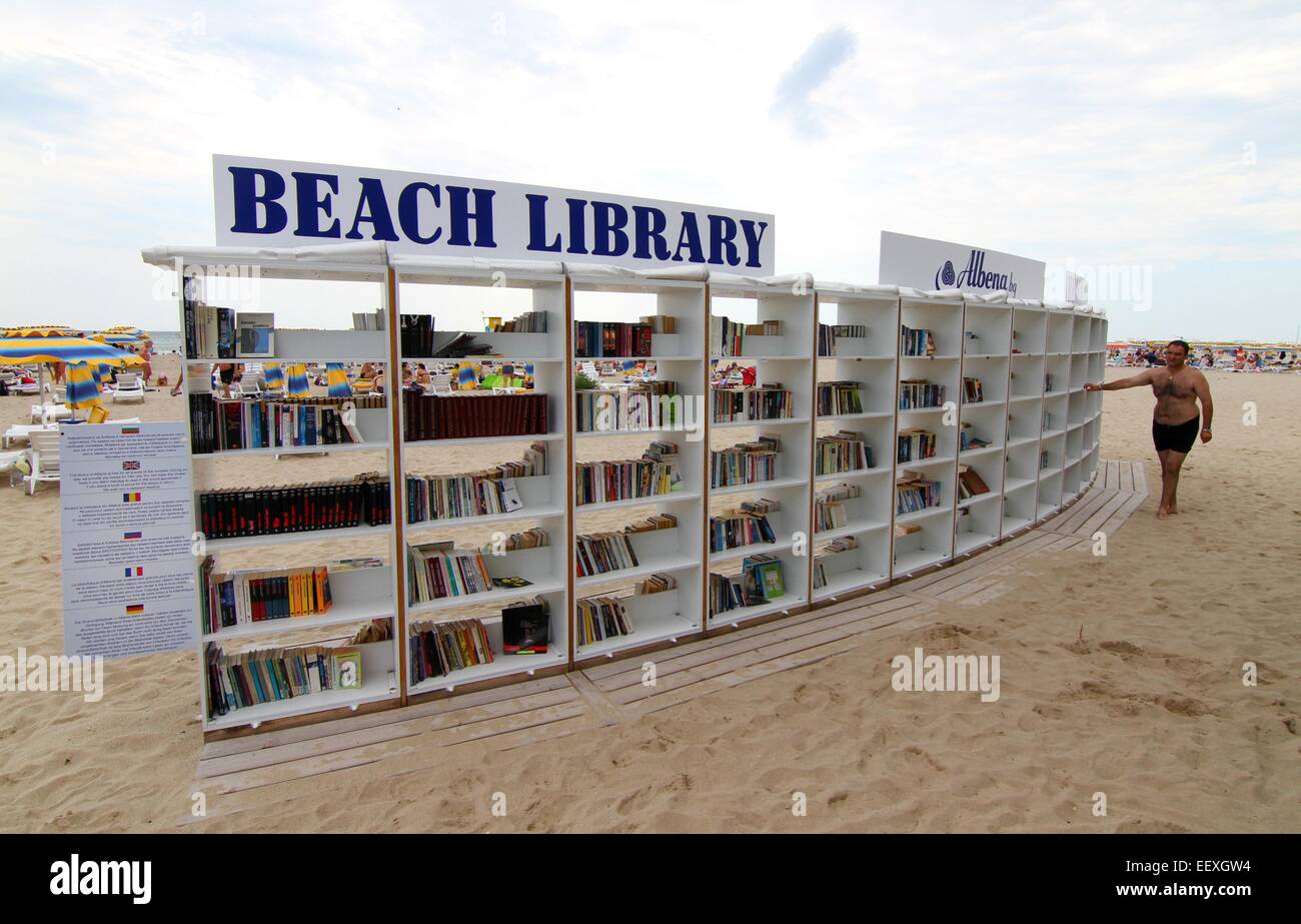 People look for and read books at the first ever free beach library opened  in Bulgaria at the Black Sea resort of Albena Stock Photo - Alamy