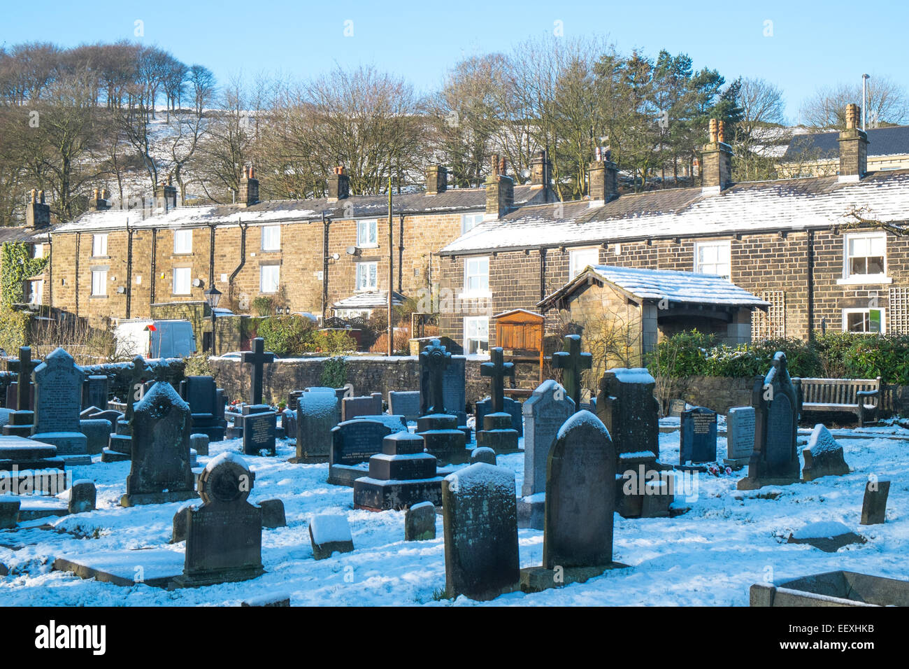 row of victorian english houses overlooking a cemetary at