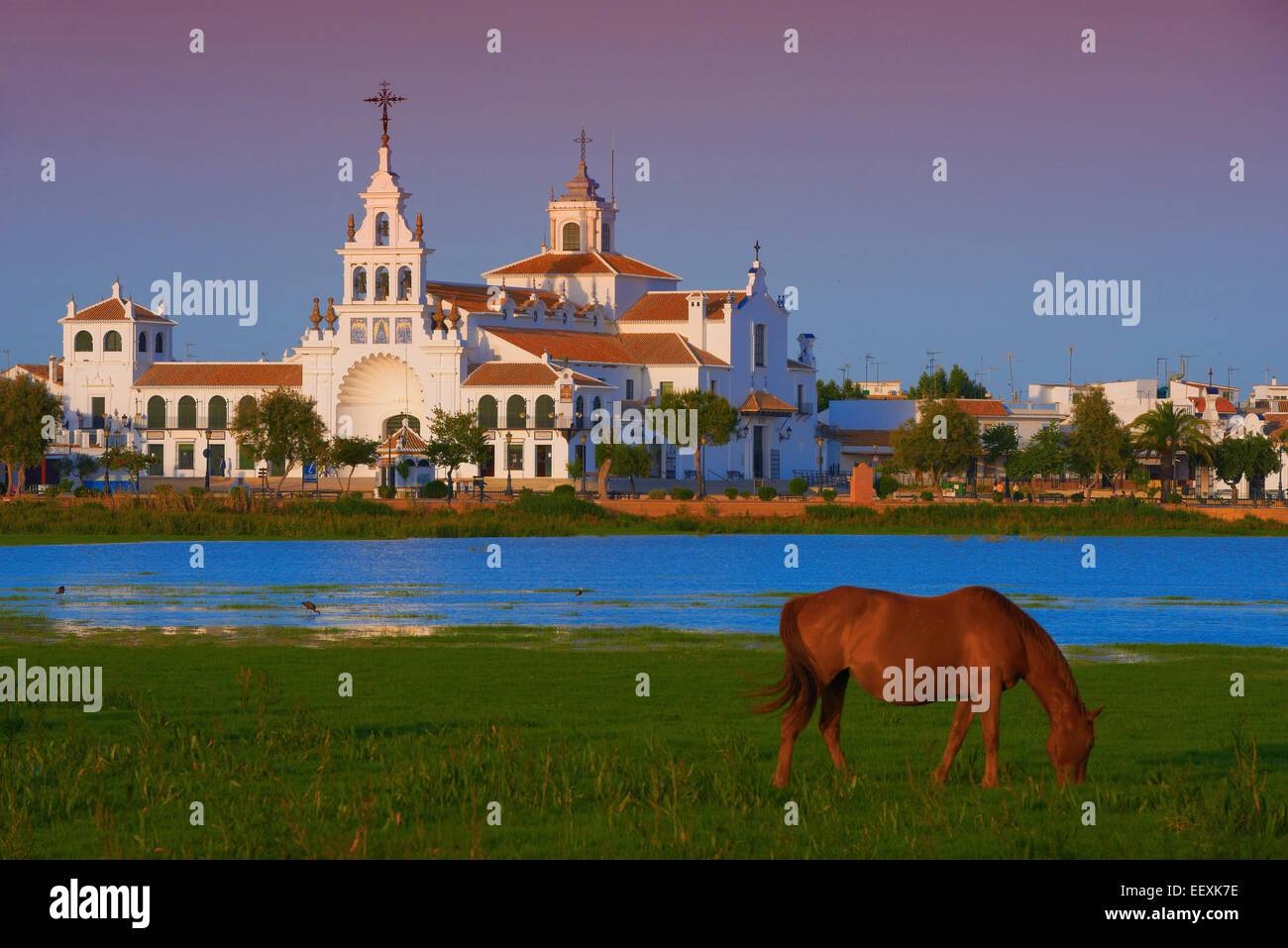 El Rocio village and Ermita del Rocío hermitage in morning light, El Rocio, Almonte, Marismas de Doñana, Huelva province Stock Photo