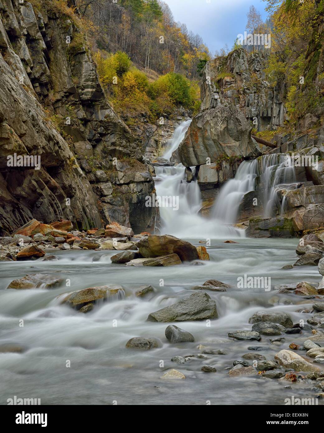 Waterfalls of the Grand Eyvia in autumn, Gran Paradiso National Park, Valle di Cogne, Piedmont, Italy Stock Photo