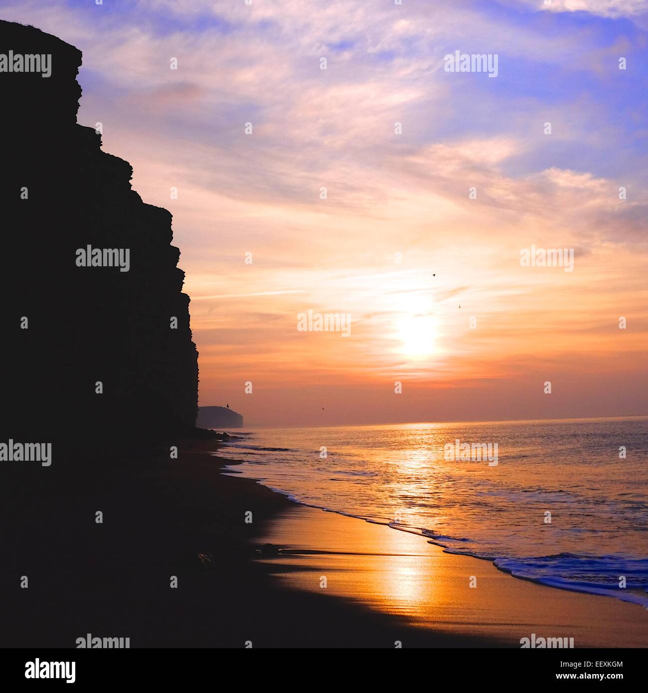 West Bay, Dorset, UK. 23 January 2015. The West Bay cliffs, made famous in the TV series Broadchurch, illuminated by the rising sun on a decidedly chilly morning on the Dorset Coast Credit:  Tom Corban/Alamy Live News Stock Photo