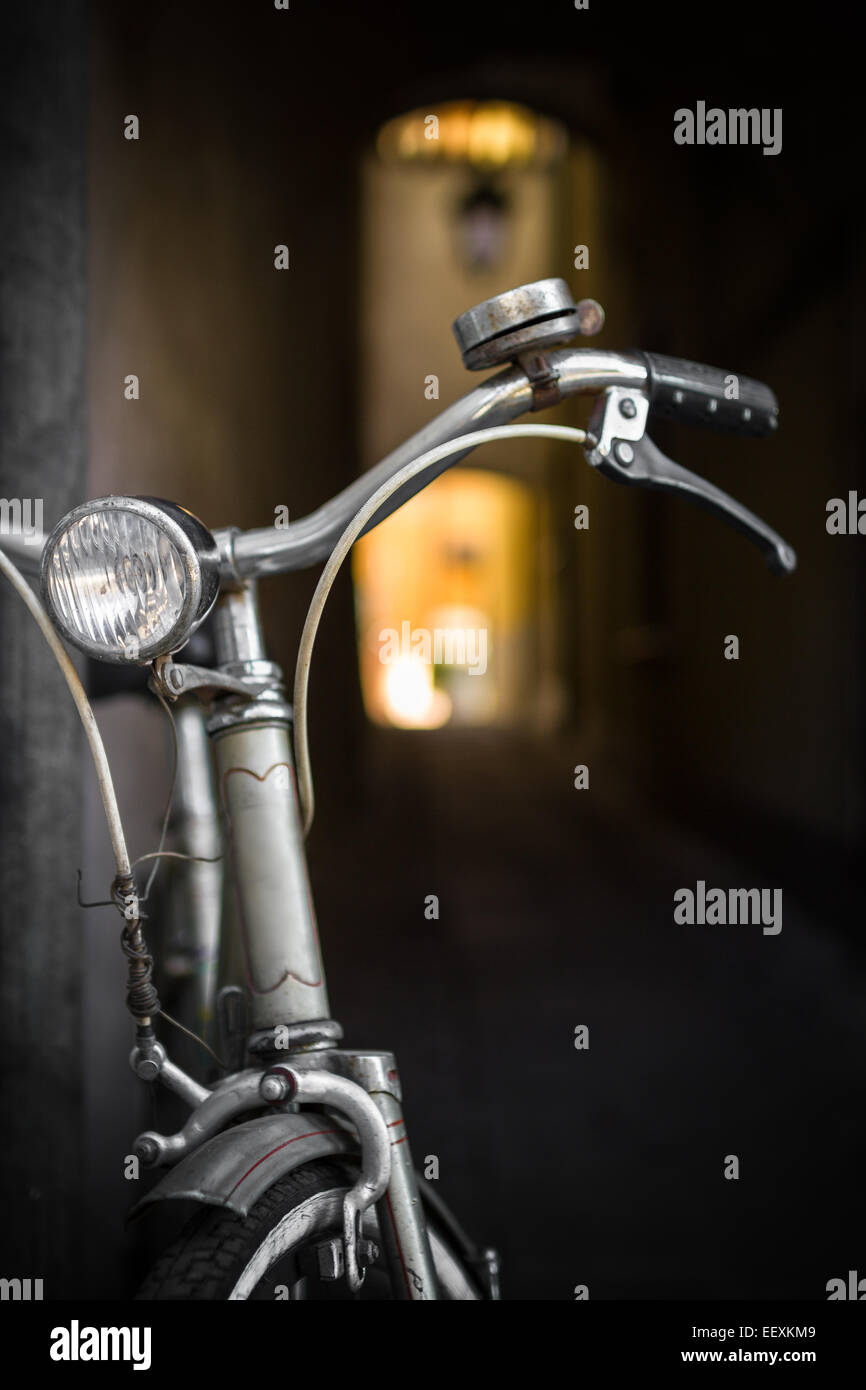 An old bicycle leaning against a wall. Stock Photo