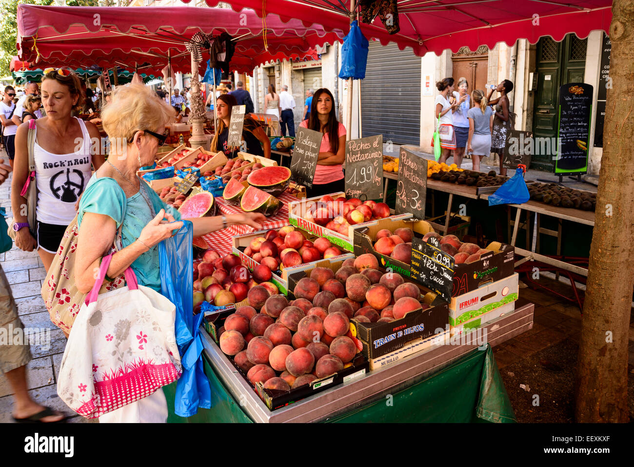 Fruit stall holder serving customers at Outdoor Market, Toulon, Var, PACA (Provence-Alpes-Cote d'Azur), France Stock Photo