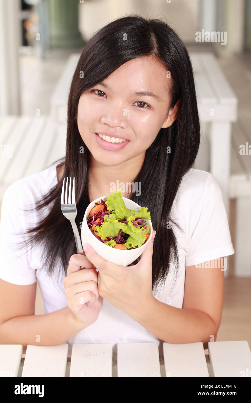 lady eat vegetable salad on the restaurant Stock Photo