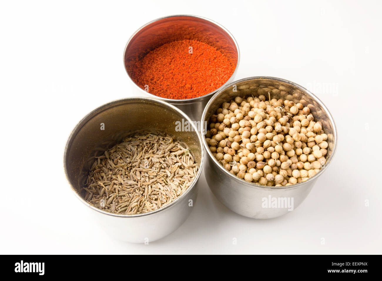 Stainless Steel Pots of Ground Chilli Cumin Seeds and Coriander Seeds Stock Photo Alamy
