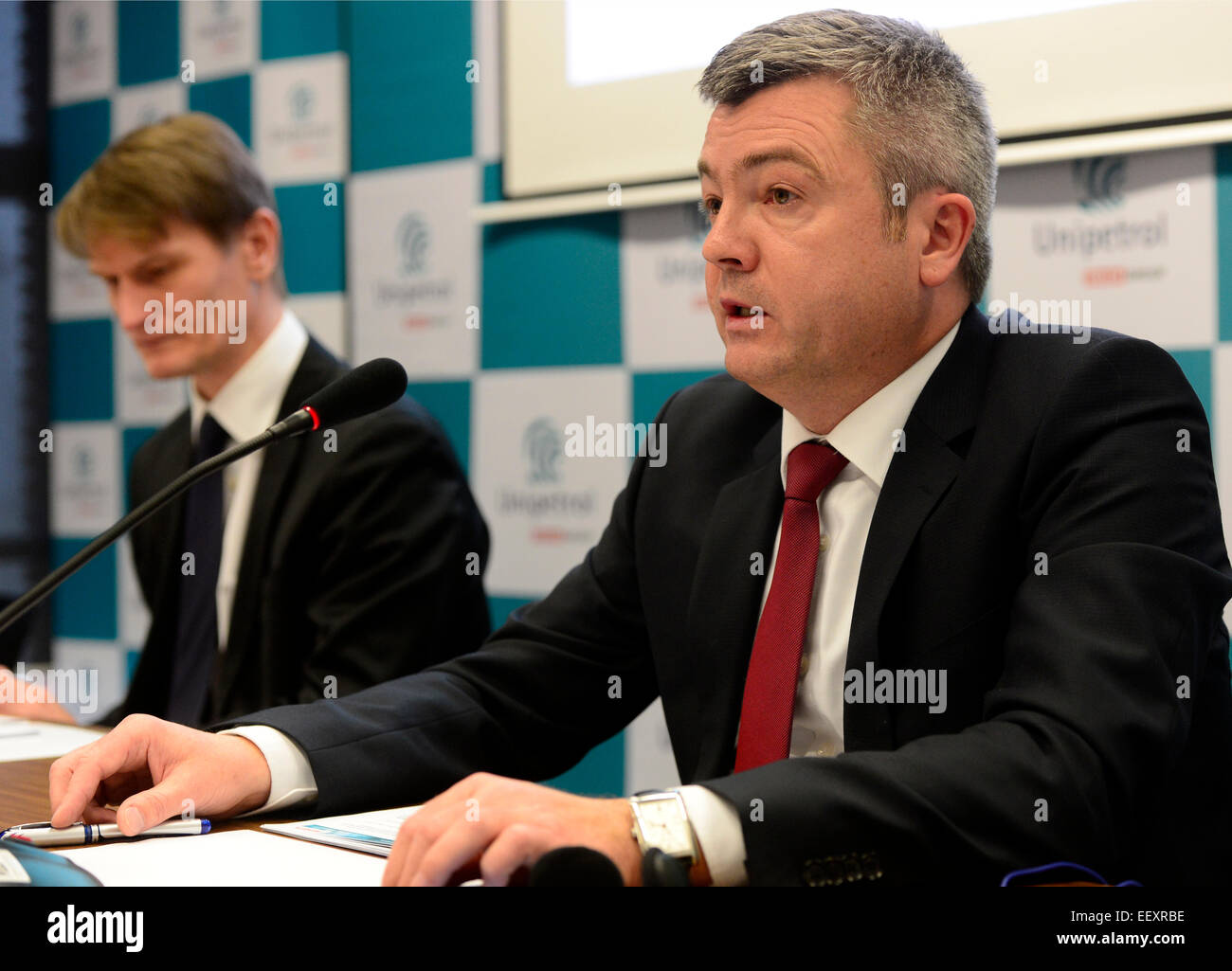 Prague, Czech Republic. 23rd Jan, 2015. Chairman of the Board of Directors and CEO Marek Switajewski (left) and Chief Financial Officer of petrochemical holding Unipetrol Miroslaw Kastelik speak during a press conference on the fourth quarter-year and year 2014 bilance of petrochemical holding Unipetrol in Prague, Czech Republic, January 23, 2015. Unipetrol cut loss to Kc556m last year from 2013´s Kc1.396bn and its sales increased by a quarter to Kc124.2bn. In the last quarter of 2014, Unipetrol made a Kc598m profit. © Roman Vondrous/CTK Photo/Alamy Live News Stock Photo