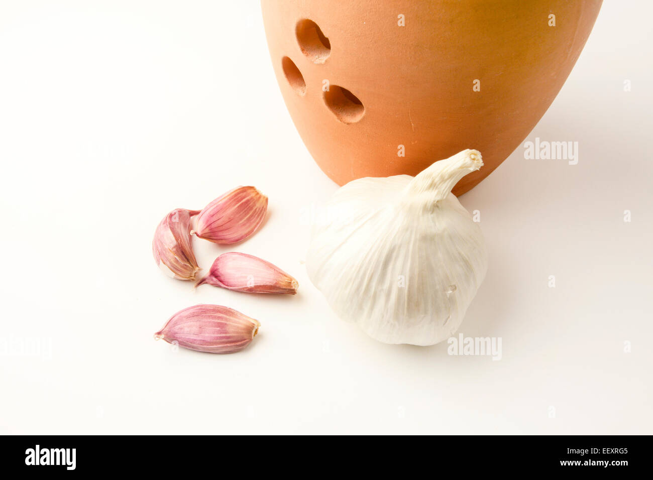 Garlic bulb with four cloves and storage jar Stock Photo Alamy
