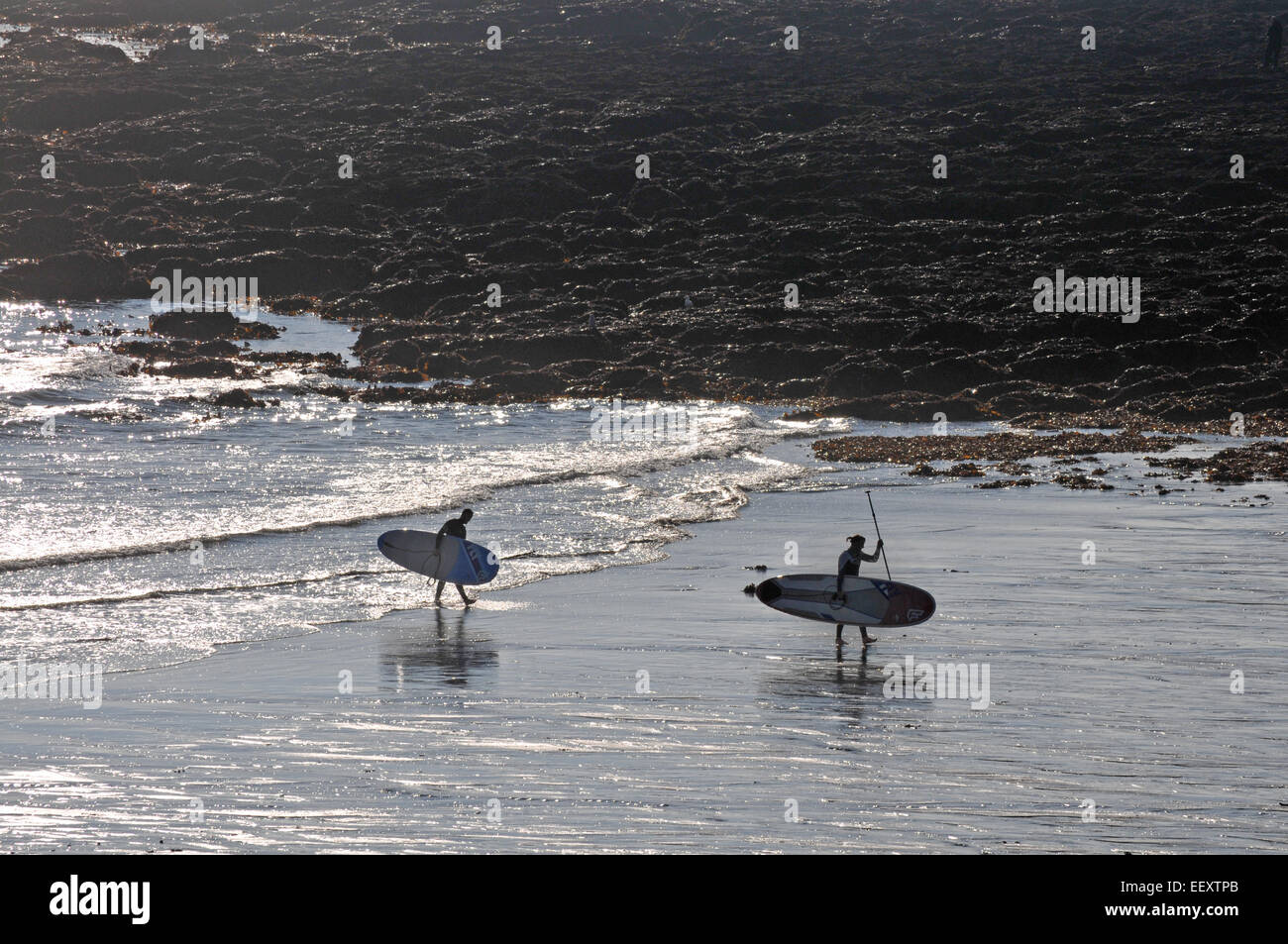 Two Surfers On The Beach With Her Boards Hi res Stock Photography And two-surfers-on-the-beach-with-her-boards-hi-res-stock-photography-and