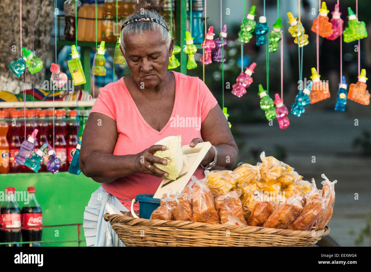 Street stall food seller grating cabbage in the Parque Central in the