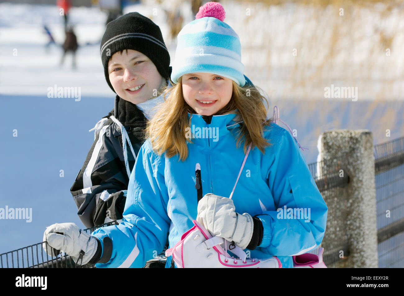 Brother and sister outdoors in winter Stock Photo - Alamy