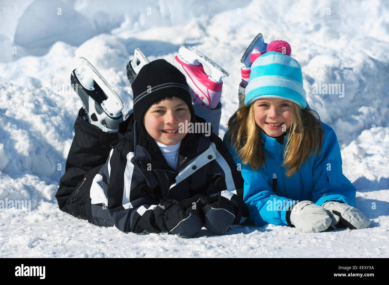 Brother and sister playing outdoors in winter Stock Photo - Alamy