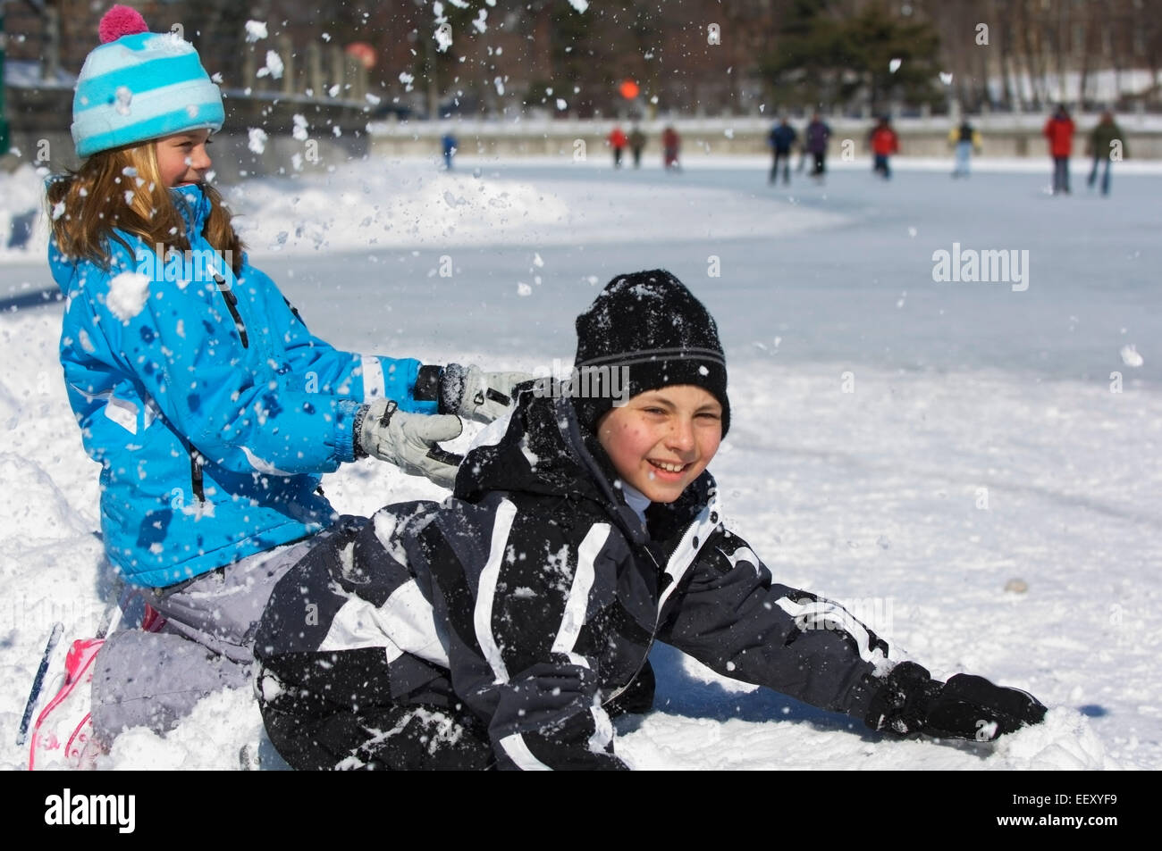 Brother and sister playing outdoors in winter Stock Photo - Alamy