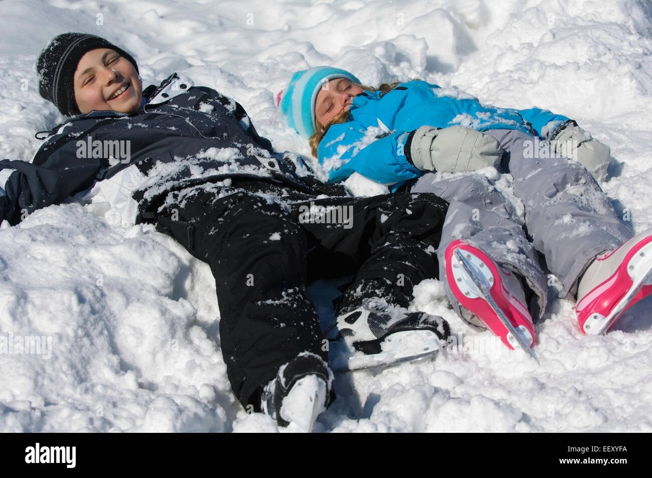 Brother and sister playing outdoors in winter Stock Photo - Alamy