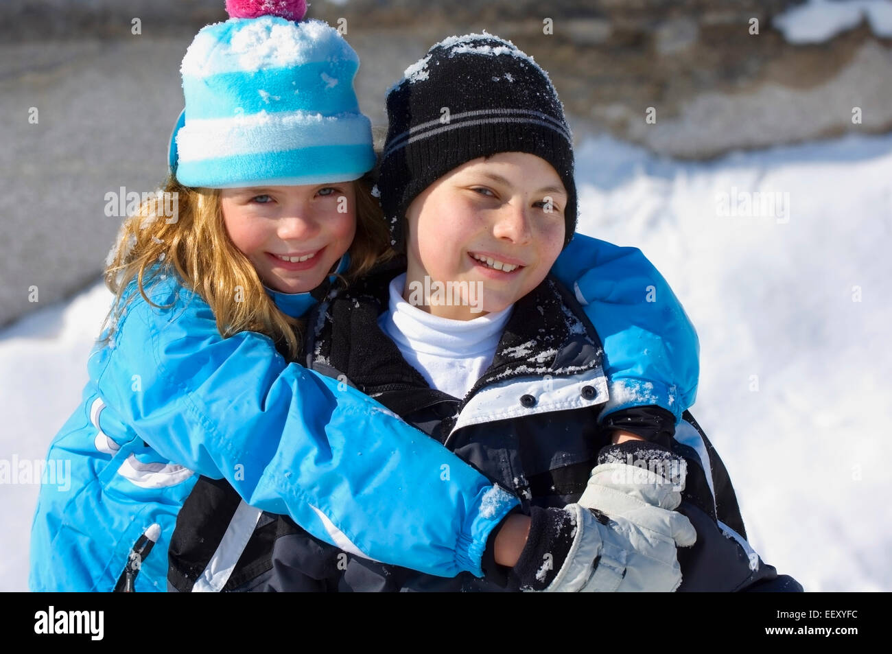 Brother and sister outdoors in winter Stock Photo - Alamy