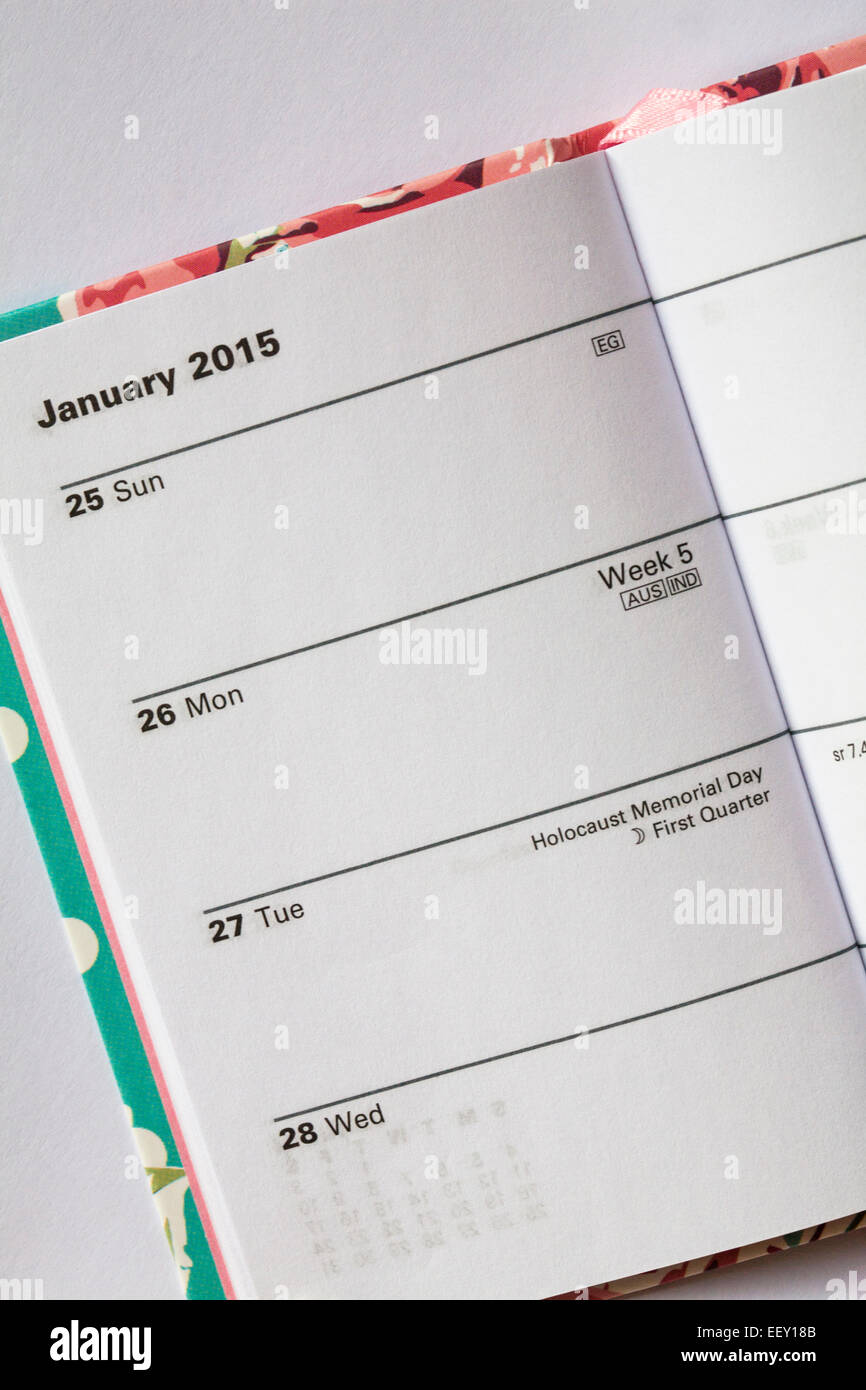 2015 diary open on page showing Holocaust Memorial Day on Tuesday 27 January on white background Stock Photo