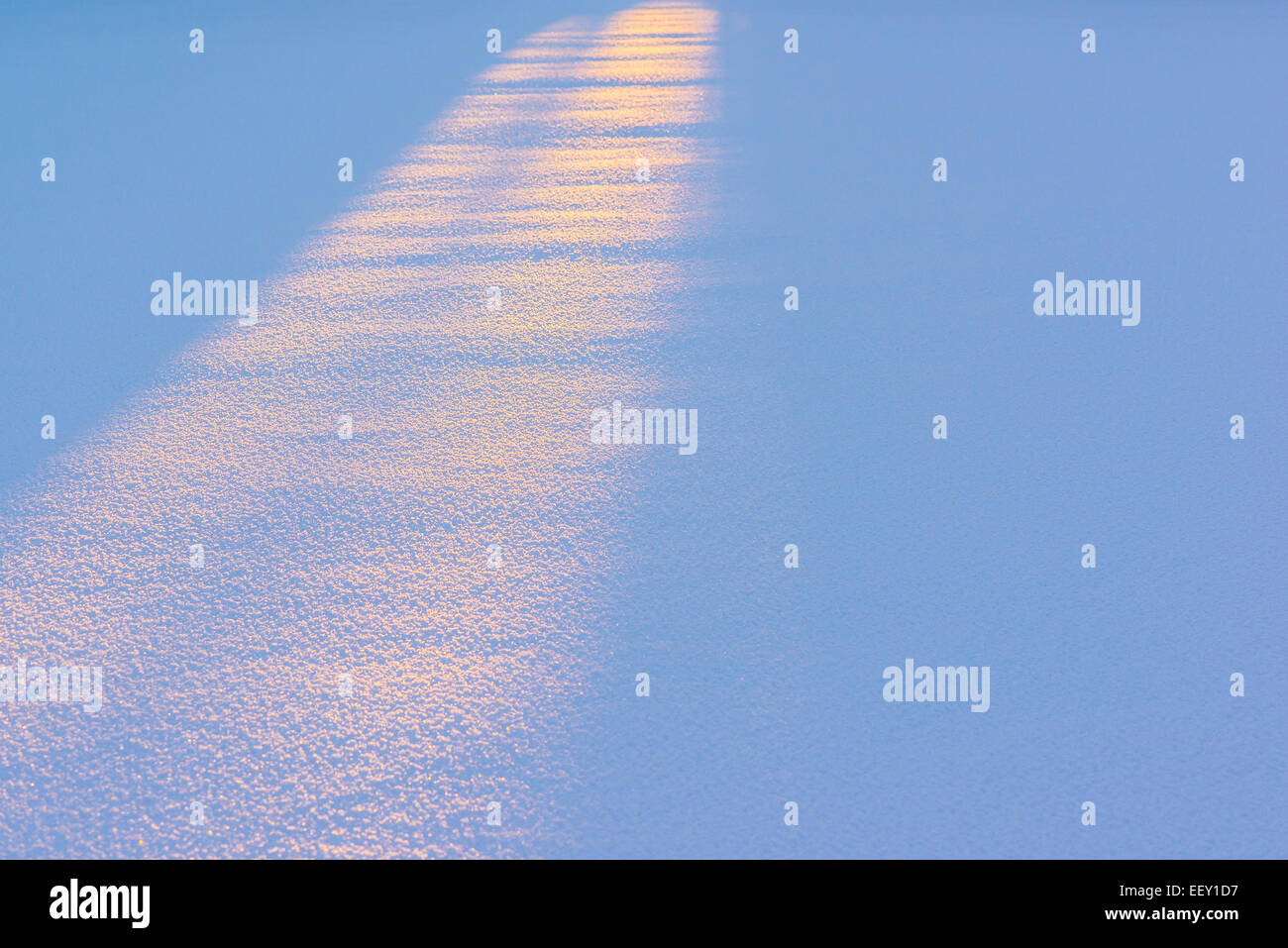 Sunrise colored snow on cold winter morning Stock Photo