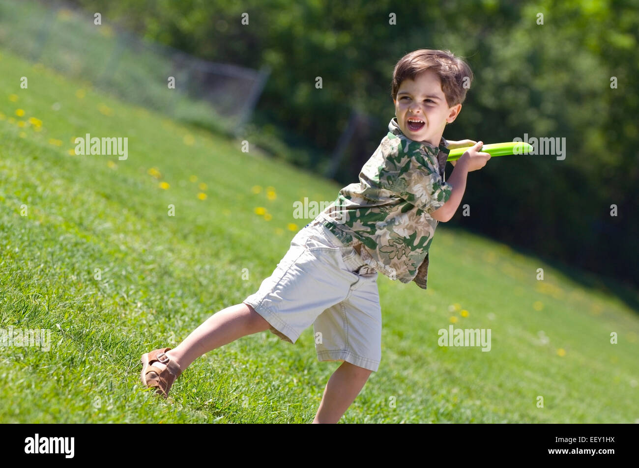 Young boy playing with flying disk Stock Photo Alamy
