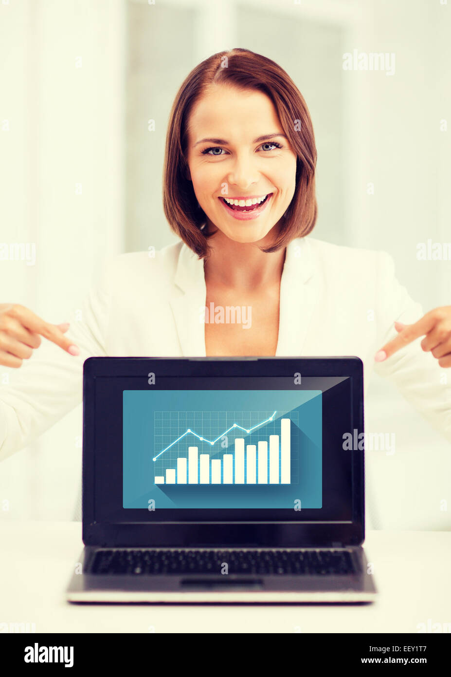 businesswoman showing laptop with graph Stock Photo - Alamy