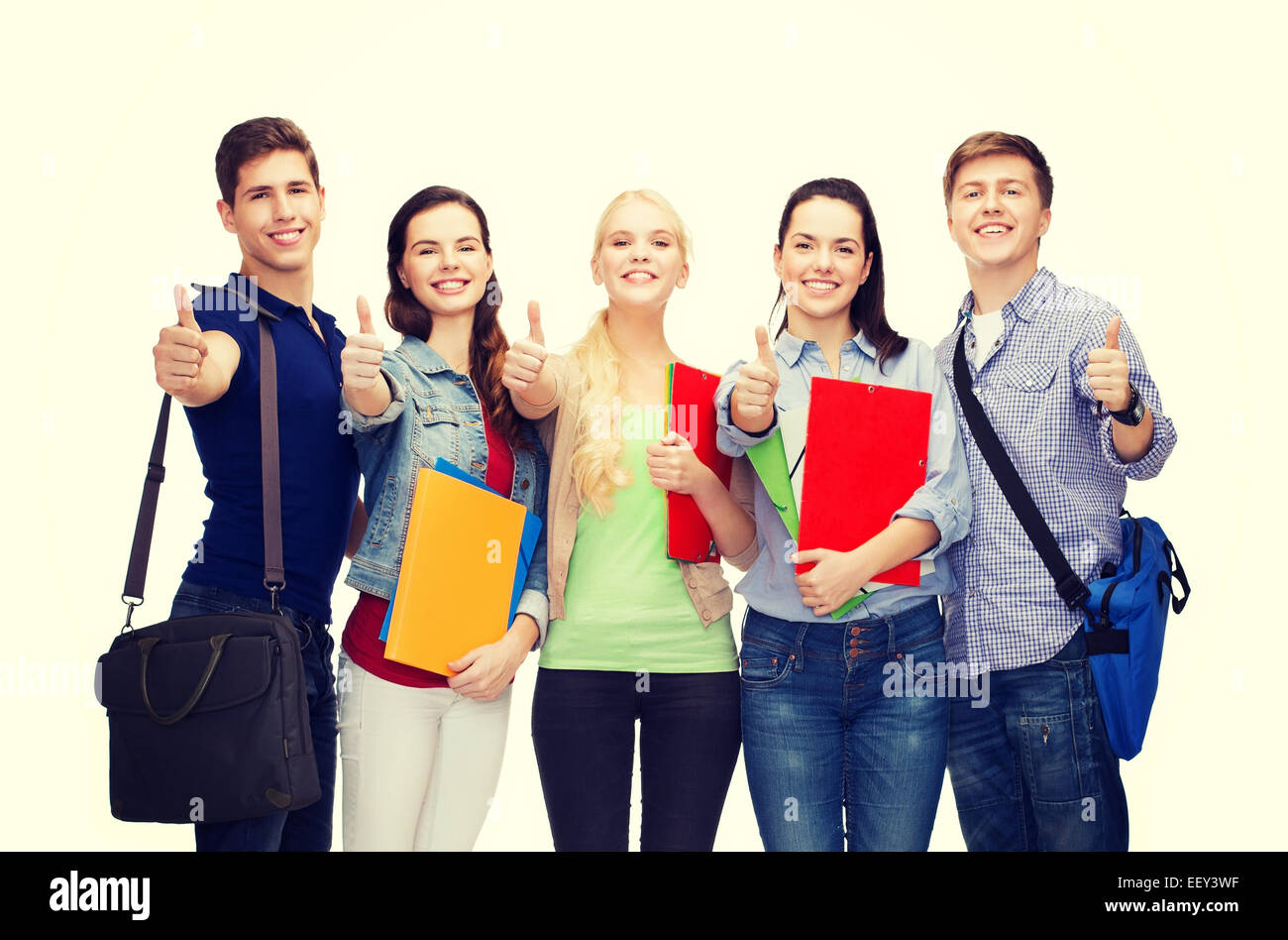 group of smiling students showing thumbs up Stock Photo - Alamy