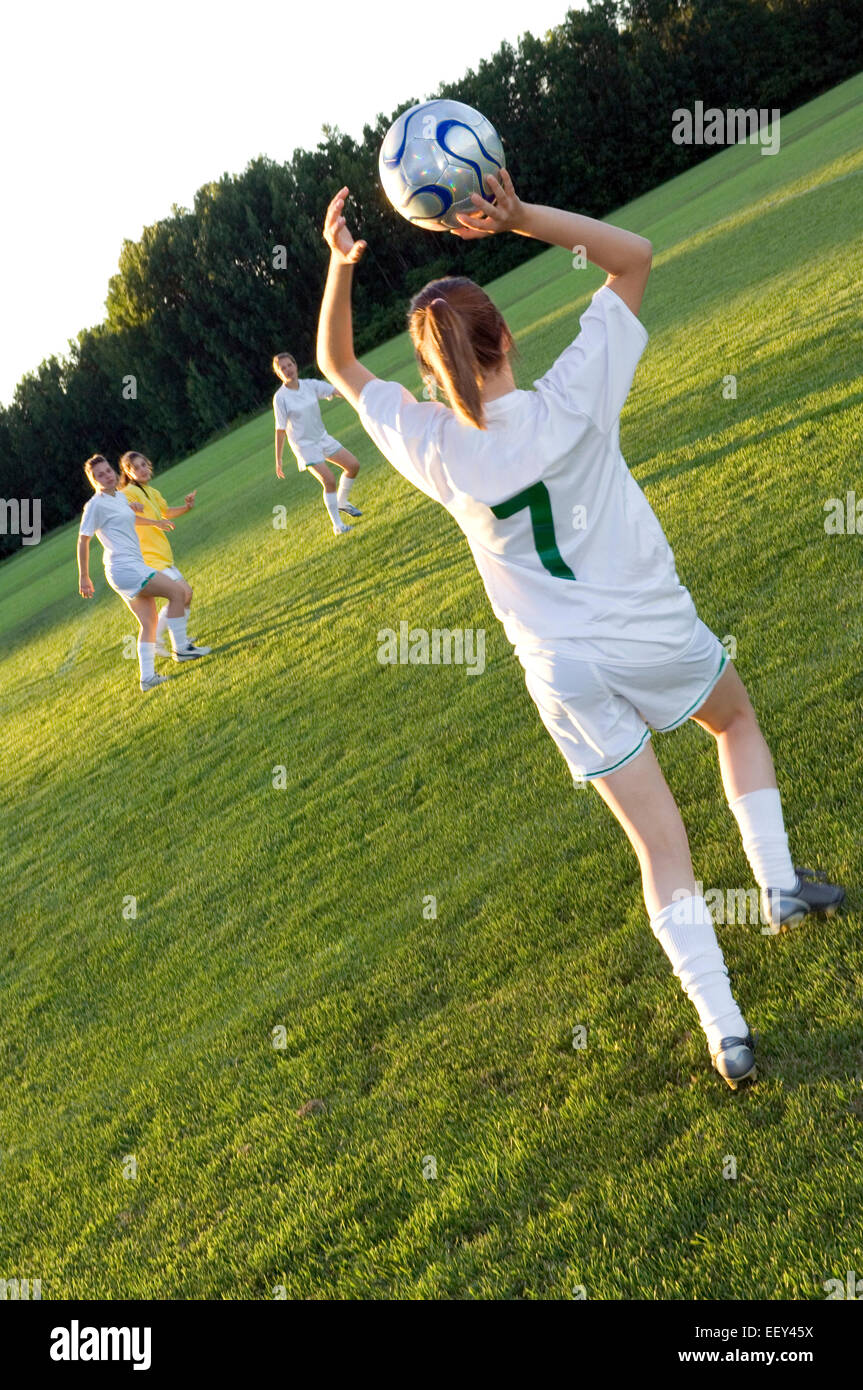 Girls playing soccer Stock Photo