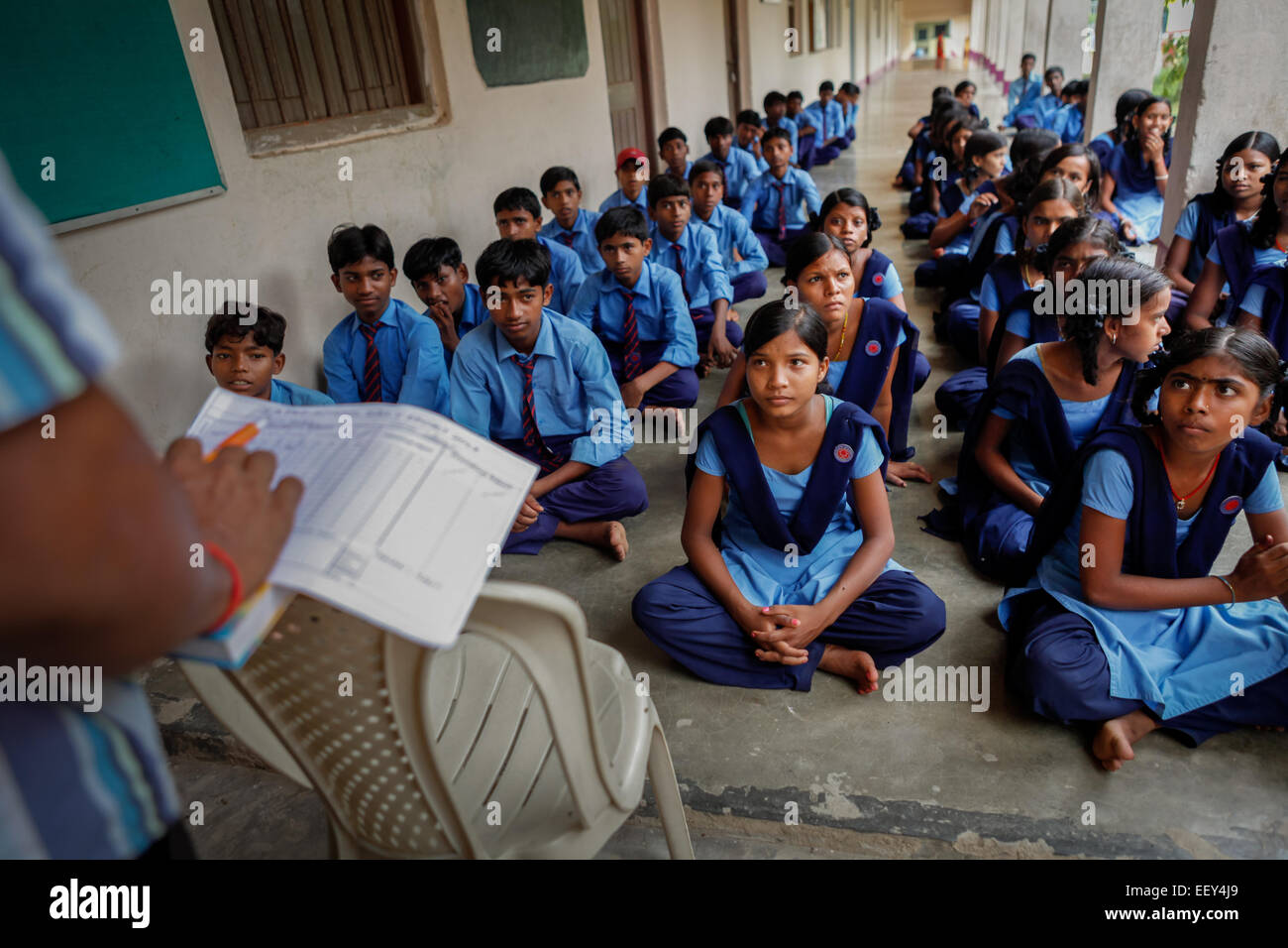 Students attending a daily briefing given by teachers after classes at Sujata Technical School, a free school in Dungeshwari village, Bihar, India. Stock Photo