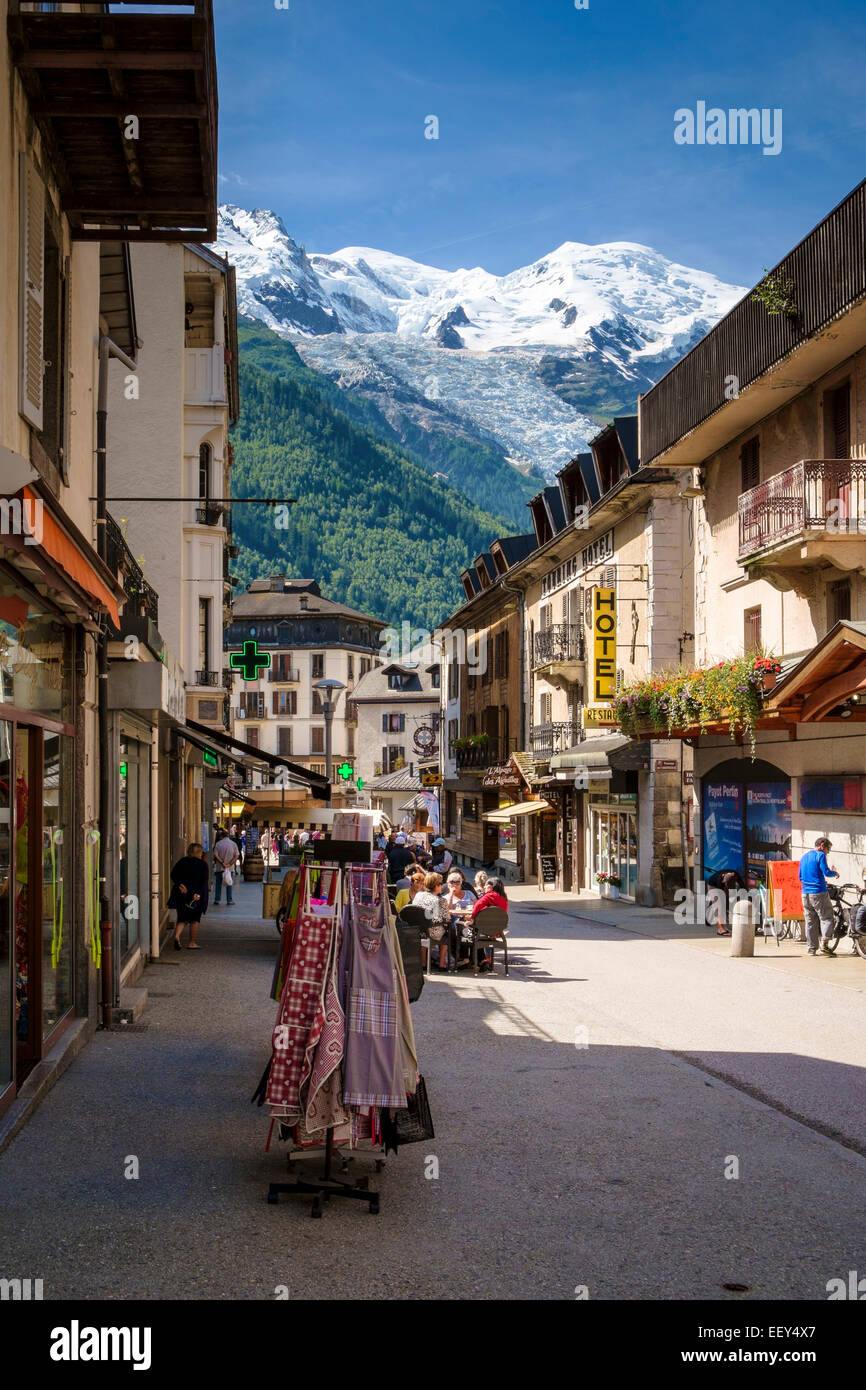 Shopping street in Chamonix, Rhone-Alpes, Haute-Savoie, French Alps, France in summer with Mont Blanc behind Stock Photo