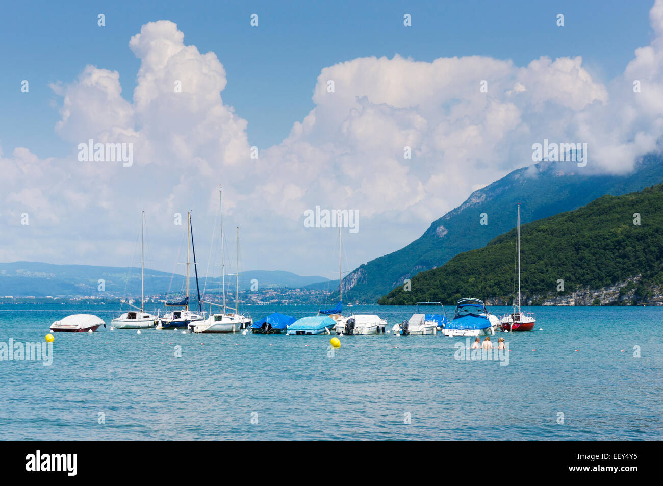 Boats and swimmers on Lake Annecy, Haute-Savoie, France, Europe Stock Photo
