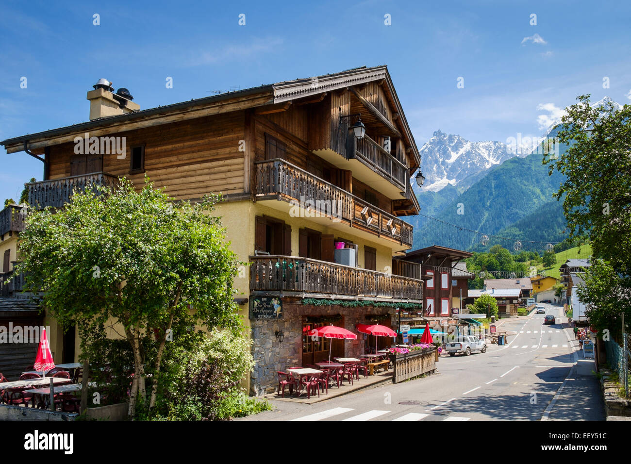 Hotel with bar cafe in Les Houches village, Chamonix valley ski resort, French Alps, Haute-Savoie, France, Europe - in summer Stock Photo