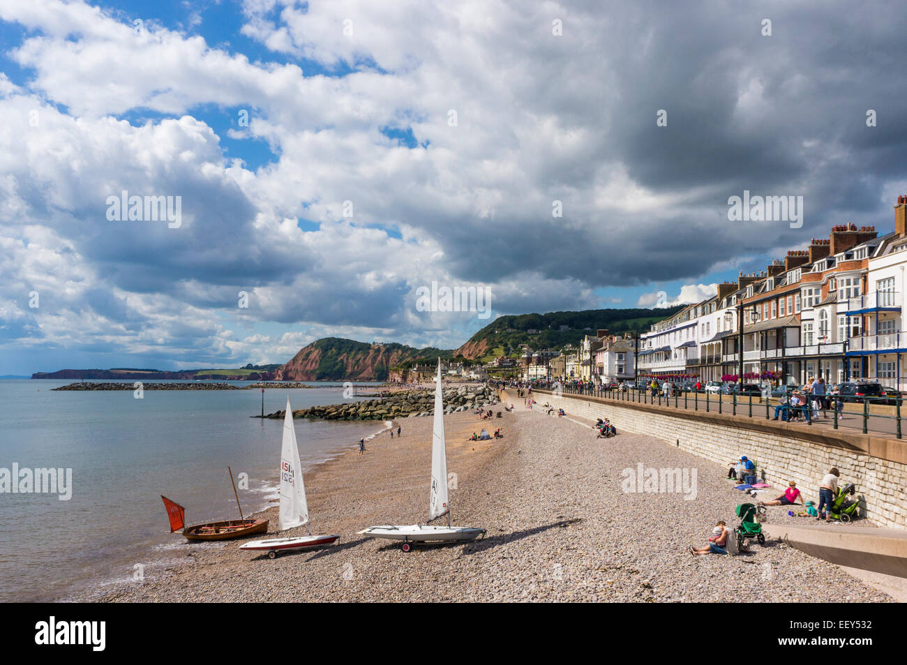 Sidmouth, East Devon, England, UK - seafront, beach and small yachts in summer Stock Photo