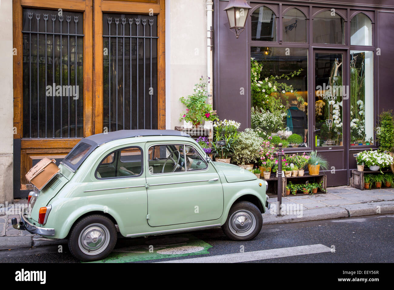 Fiat parked on the sidewalk at the florist shop, Les Marais, Paris, France Stock Photo