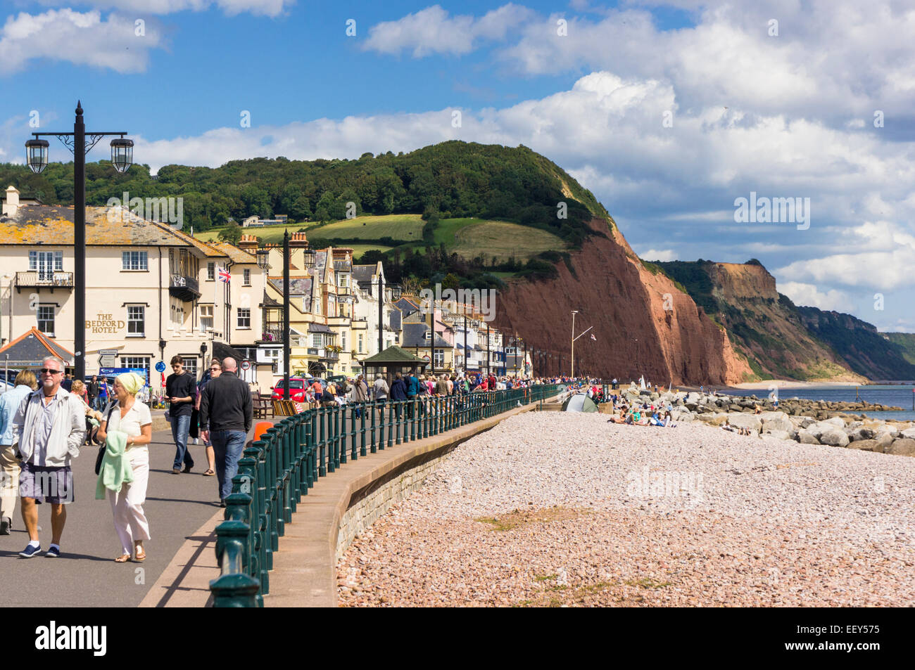 Sidmouth, East Devon, England, UK - promenade, beach and red cliffs in summer Stock Photo