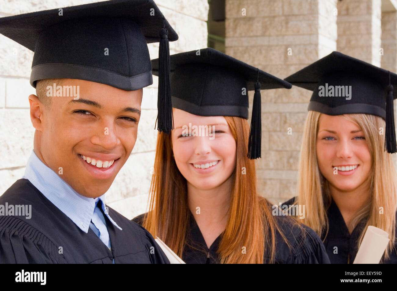Three friends at graduation ceremony Stock Photo - Alamy