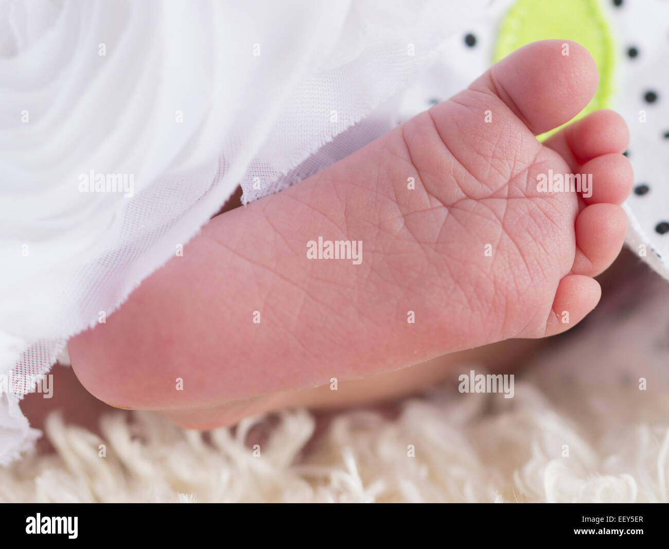 Close shot of the foot of a newborn baby girl Stock Photo