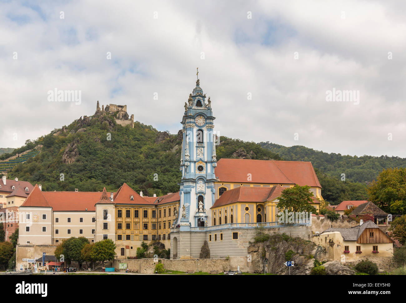 Durnstein, Austria - ornate church, castle and buildings on banks of River Danube Stock Photo