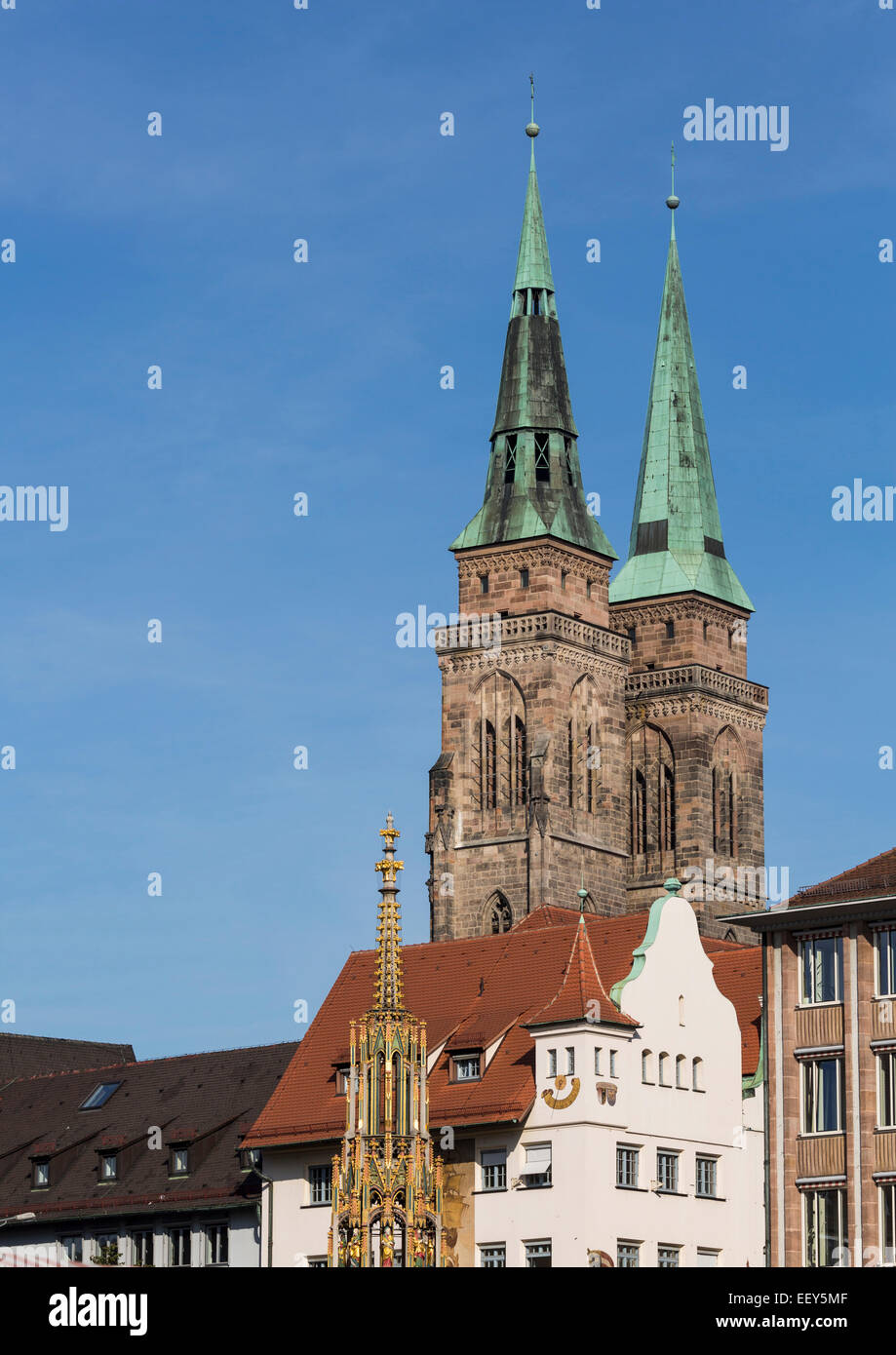 The Schoner Brunnen fountain with St Sebald Church behind in Nuremberg, Germany Stock Photo
