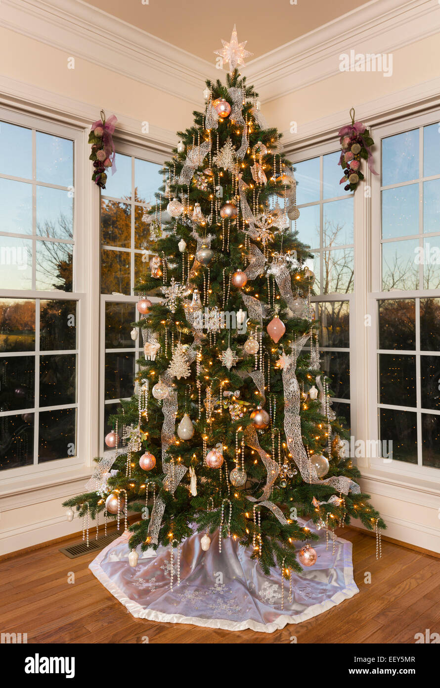 Christmas tree in the corner of a modern family home Stock Photo