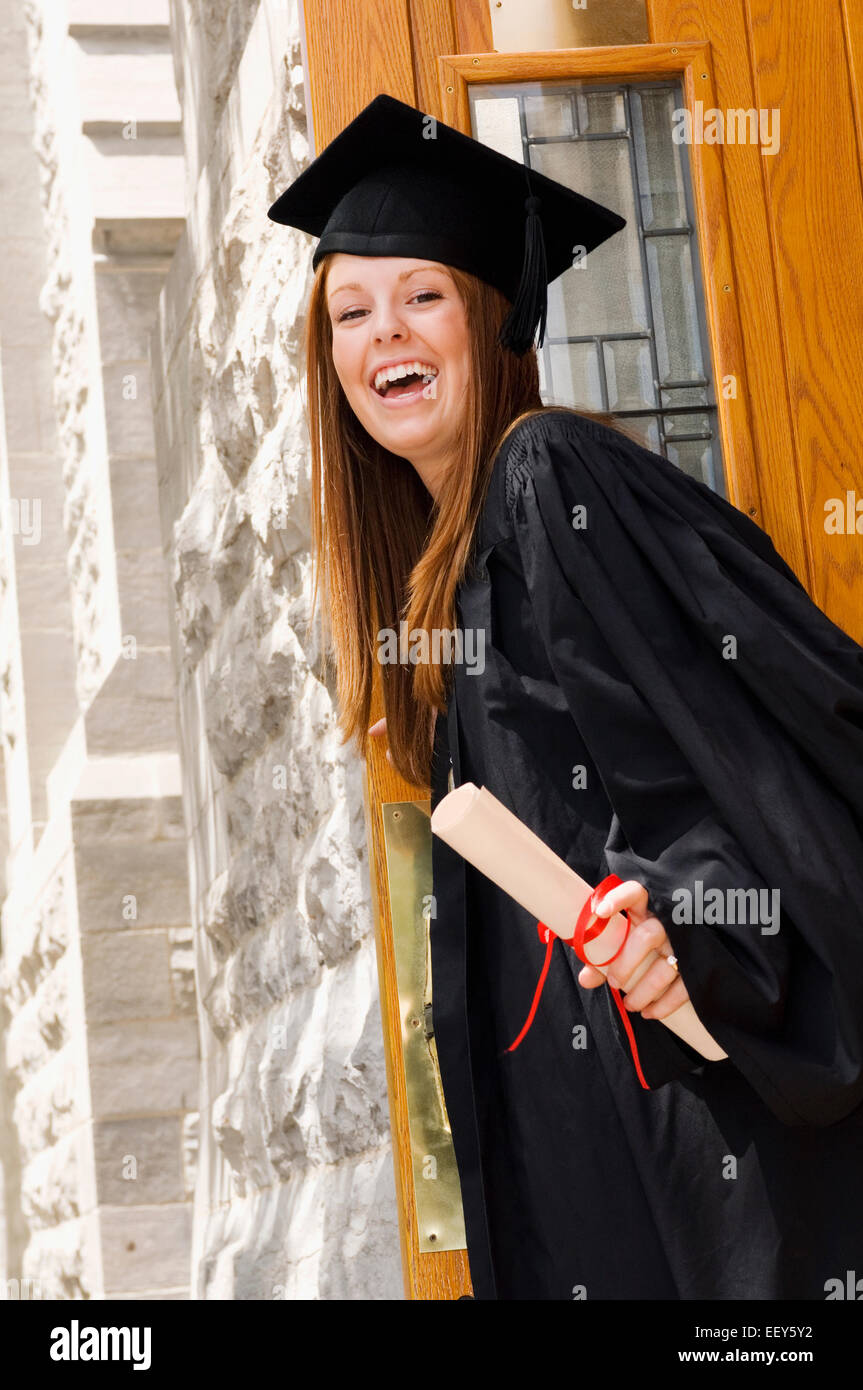 Young woman with diploma on graduation day Stock Photo - Alamy