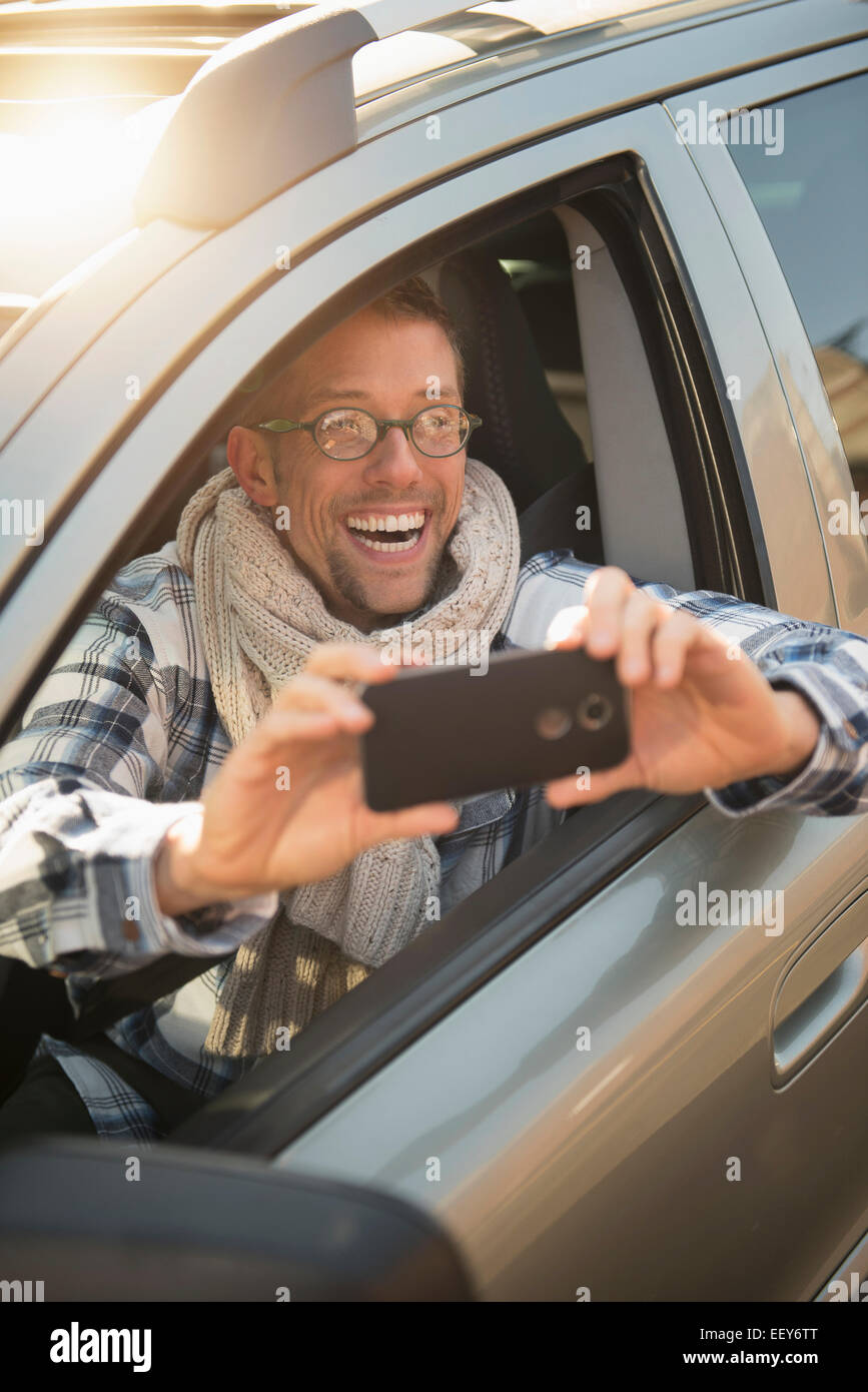 Car owner taking selfie Stock Photo