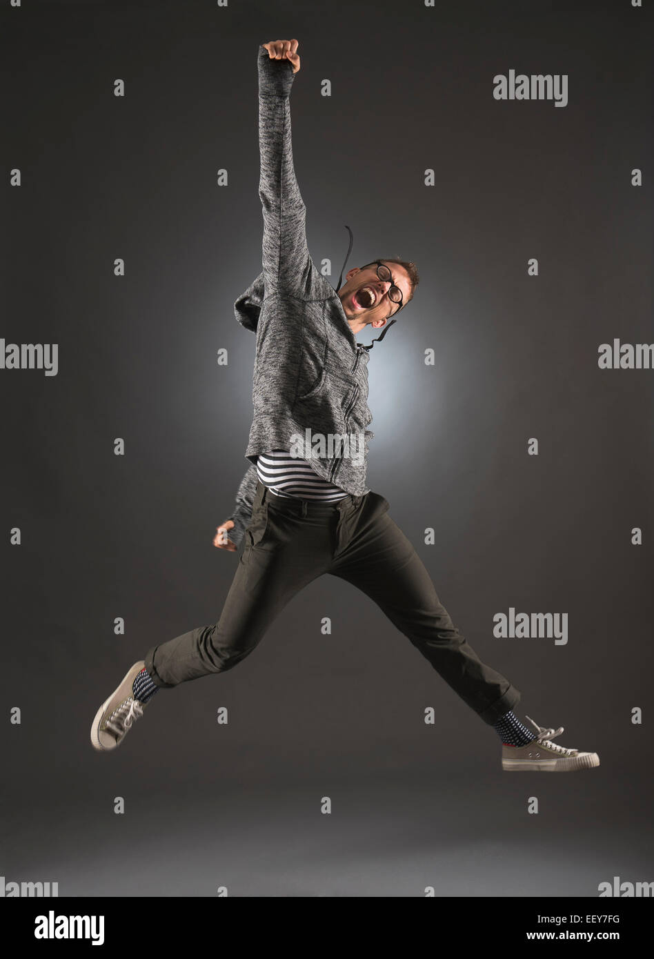 Studio shot of man jumping Stock Photo