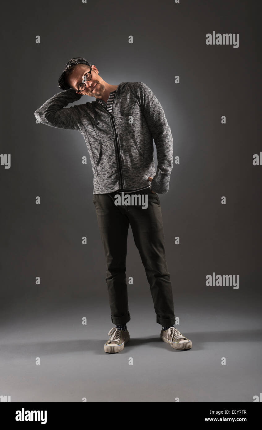 Studio shot of man in gray clothing Stock Photo