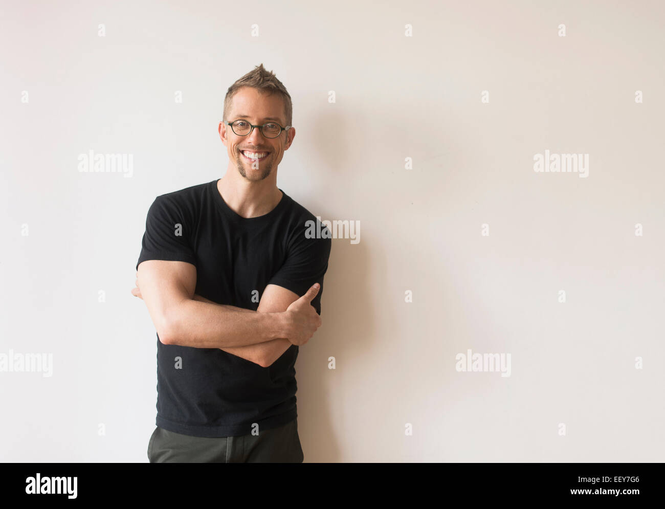 Studio portrait of smiling man Stock Photo - Alamy