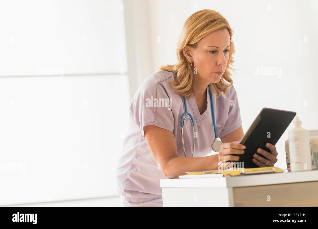 Female doctor using tablet pc Stock Photo