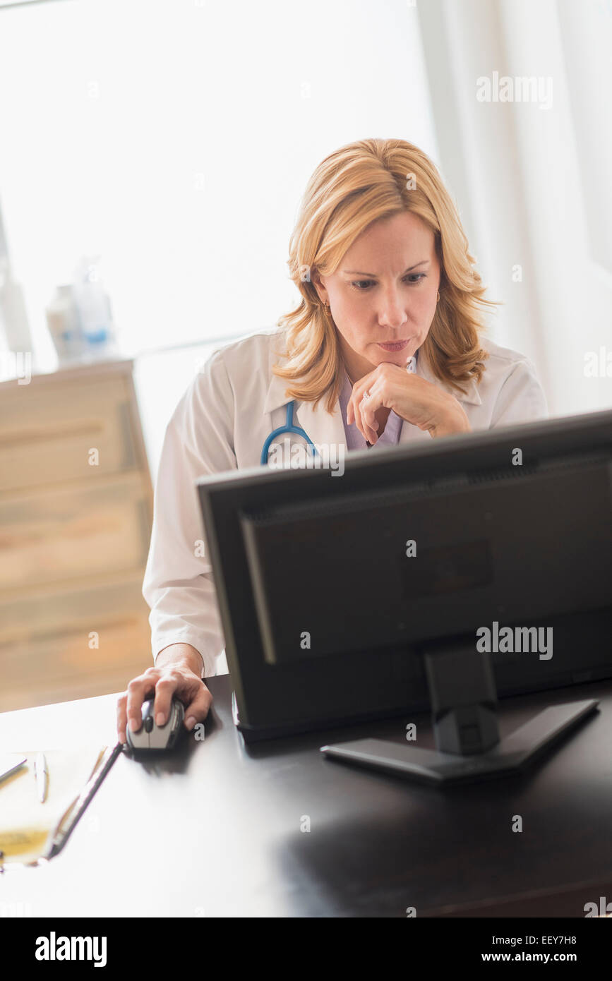 Female doctor using computer Stock Photo