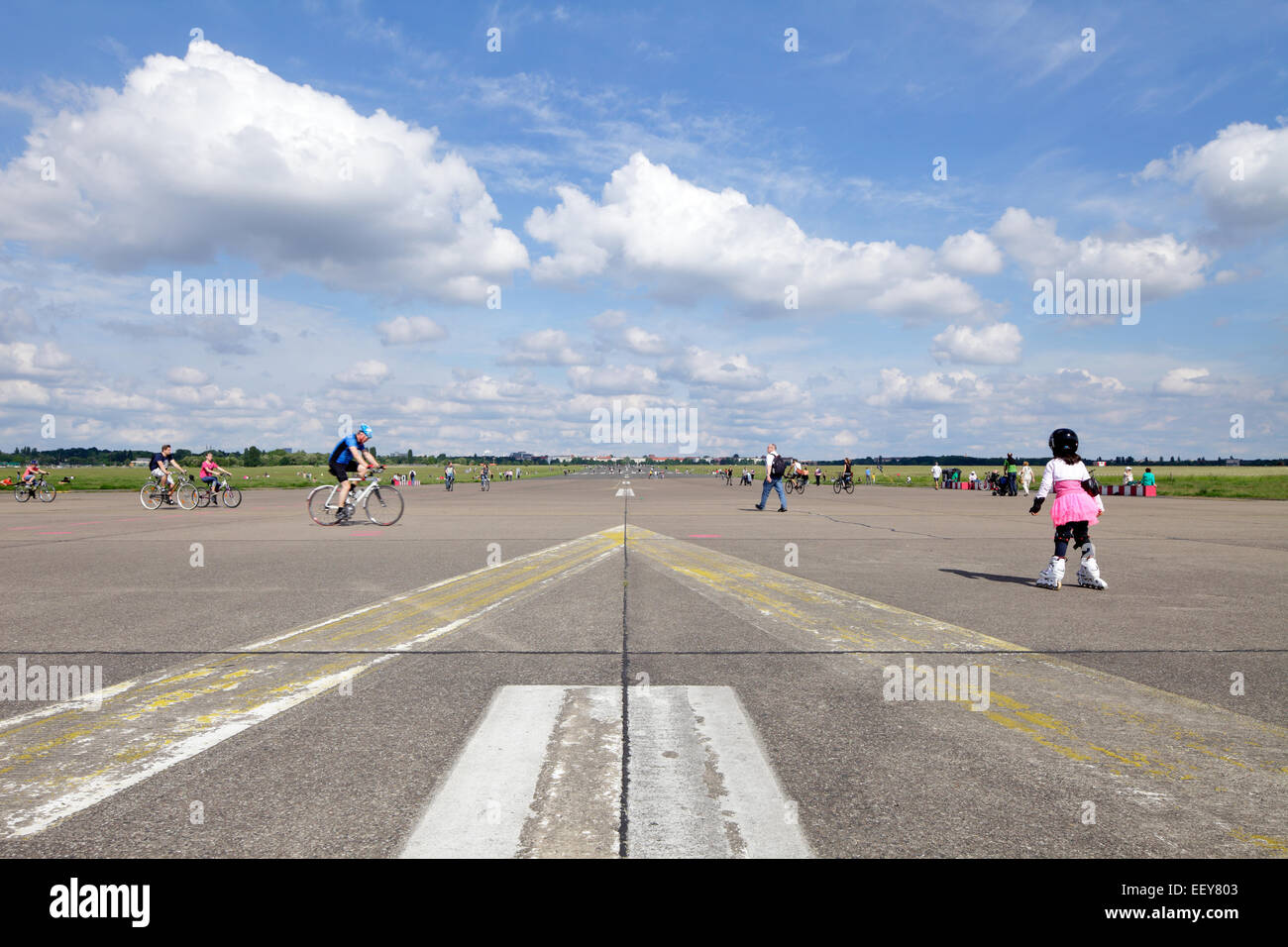 Berlin, Germany, little girl on inline skates and pedestrians on the
