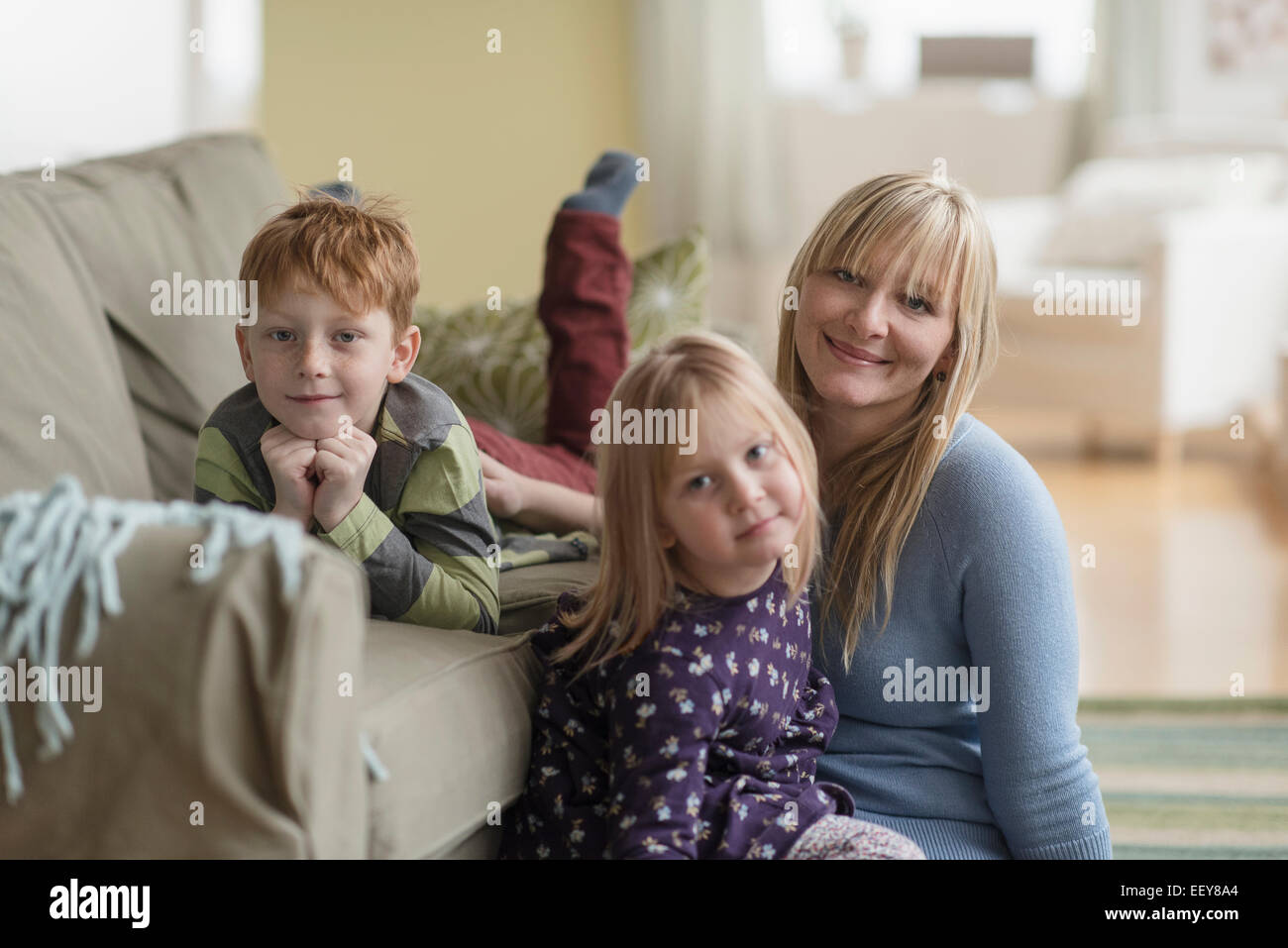 Portrait of happy mother with children (4-5, 6-7) Stock Photo